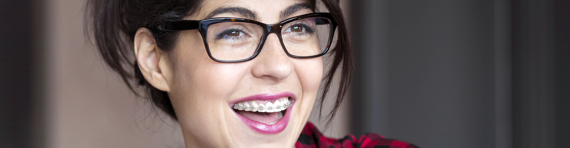 woman with teeth braces smiling